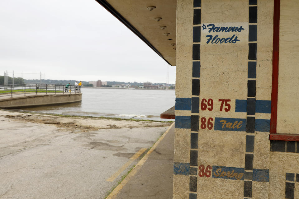A vendor shack near the Mississippi River shows high water marks from past floods, Tuesday, July 16, 2019, in Davenport, Iowa. Hundreds of communities line the Mississippi River, but Davenport is among the few where people can dip their toes into the water without scaling a flood wall or levee. (AP Photo/Charlie Neibergall)