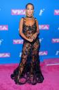 <p>Rita Ora, meanwhile, wore the dress version of our notepad that we take to meetings, with her black pants on show.</p>