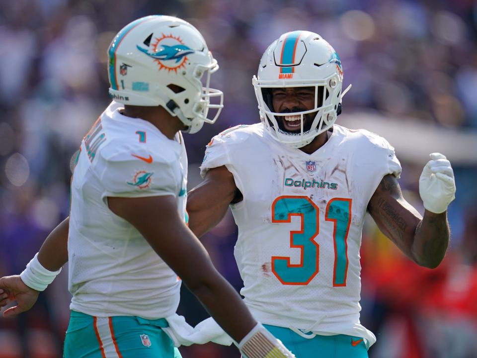 Raheem Mostert celebrates with quarterback Tua Tagovailoa after a touchdown against the Baltimore Ravens.