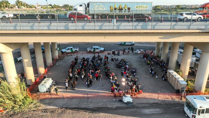 Eagle Pass, Texas, Saturday, September 23, 2023 - People who crossed the US/Mexico border are held at a border patrol processing center located below the Eagle Pass International Bridge. (Robert Gauthier/Los Angeles Times)