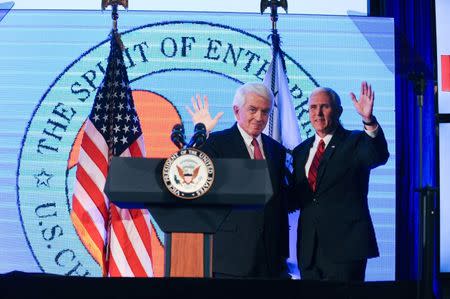 U. S. Vice President Mike Pence greets Thomas Donohue, president and CEO of the U.S. Chamber of Commerce before addressing Chamber of Commerce "Invest in America!" summit in Washington U.S., May 18, 2017. REUTERS/Mary F. Calvert