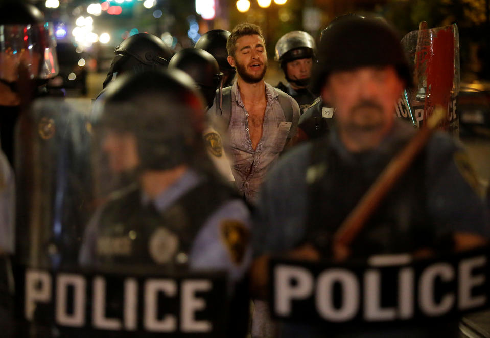 Police officers detain a man protesting on Sept. 16, the day after the not-guilty verdict in the murder trial of Jason Stockley, a white former St. Louis police officer, charged with the 2011 shooting of Anthony Lamar Smith, who was black. (Photo: Joshua Lott/Reuters)