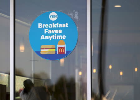 A McDonald's store displays a sign informing customers that they now serve breakfast all day long, at their location in Encinitas, California August 13, 2015. REUTERS/Mike Blake