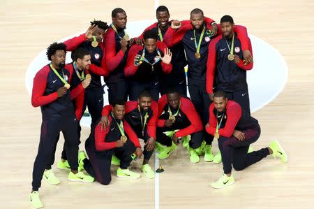 2016 Rio Olympics - Basketball - Final - Men's Gold Medal Game Serbia v USA - Carioca Arena 1 - Rio de Janeiro, Brazil - 21/8/2016. United States players pose with their gold medals during the presentation ceremony for men's basketball. REUTERS/Antonio Bronic