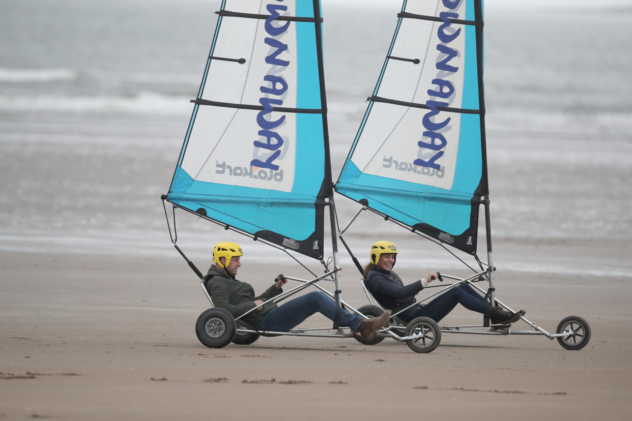 EMBARGOED UNTIL 1050 WEDNESDAY MAY 26 The Duchess of Cambridge with a group of young carers land yachting on the beach at St Andrews. Picture date: Wednesday May 26, 2021.