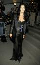 <p>In a leather gown and jacket at the 1997 Met Gala honoring Gianni Versace.</p>