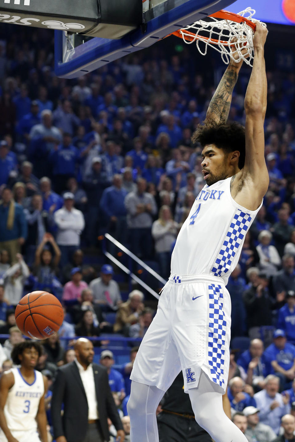 Kentucky's Nick Richards dunks during the first half of an NCAA college basketball game against Missouri in Lexington, Ky., Saturday, Jan 4, 2020. (AP Photo/James Crisp)