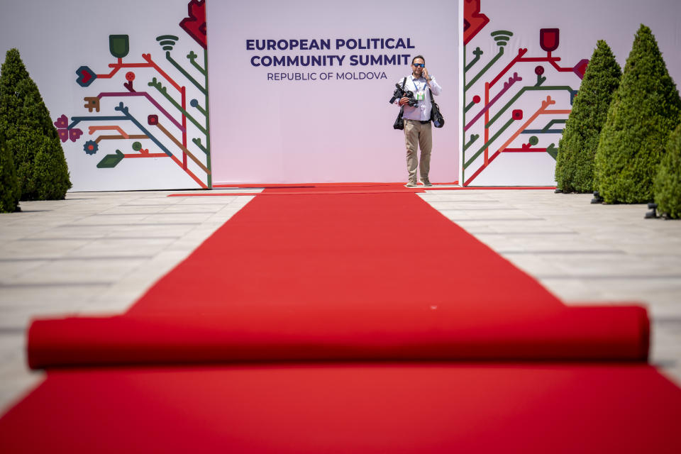 A man stands by banners during preparations at the Castel Mimi in Bulboaca, Moldova, Wednesday, May 31, 2023. Moldova will host the Meeting of the European Political Community on June 1, 2023. Preparations for a major summit of European leaders were still underway in Moldova on Wednesday, a sign of the Eastern European country’s ambitions to draw closer to the West and break with its Russian-dominated past amid the war in neighboring Ukraine. (AP Photo/Andreea Alexandru)