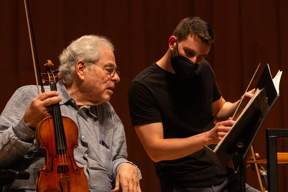 Left to right, Itzhak Perlman, violinist, and Benjamin Manis, conductor for the Utah Symphony, look at sheet music during a rehearsal at Abravanel Hall in Salt Lake City on Saturday, Oct. 14, 2023. | Megan Nielsen, Deseret News