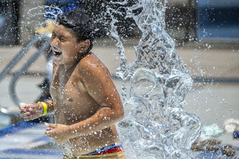 With temperatures breaking records in many areas of Southern California this week, people cool off at the Santa Clarita Aquatic Center in Santa Clarita, Calif., on Monday, July 8, 2024. (Hans Gutknecht/The Orange County Register via AP)