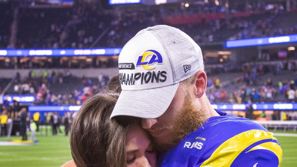 Cooper Kupp hugs his wife Anna Croskrey as they celebrate a 20-17 victory over the San Francisco 49ers in the NFC Championships at SoFi Stadium on Sunday, Jan. 30, 2022 in Los Angeles, CA