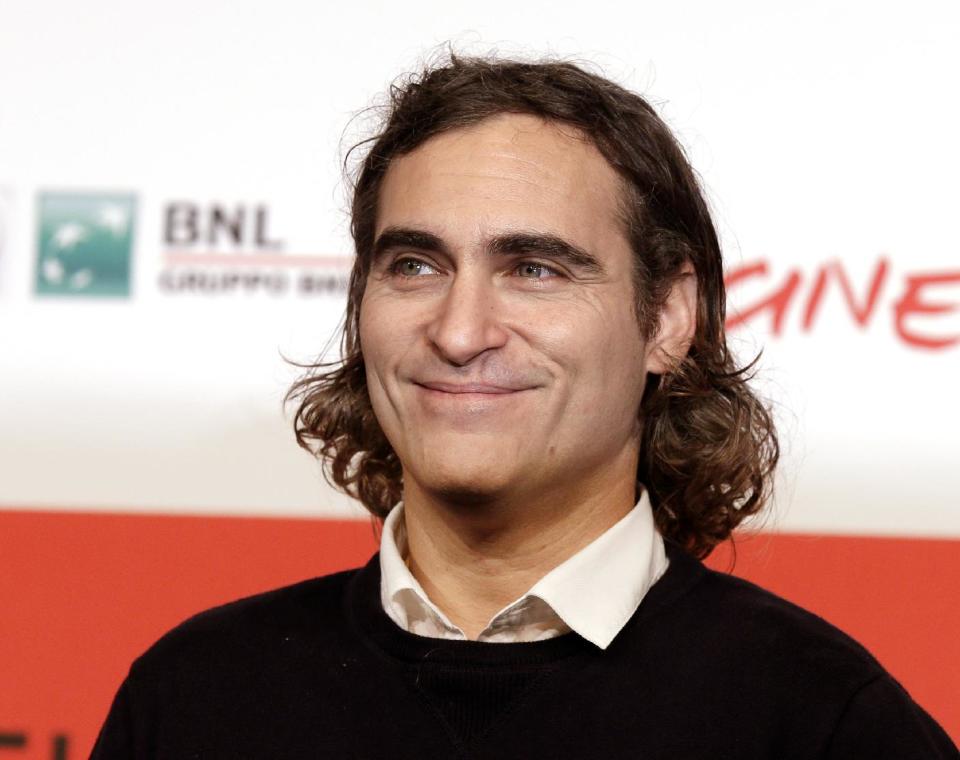 FILE - This Nov. 10, 2013 file photo shows actor Joaquin Phoenix during a photo call for the movie "Her" at the 8th edition of the Rome International Film Festival in Rome. The film has been selected as the best film of the year by the National Board of Review and Phoenix was nominated for a Golden Globe for best actor in a motion picture musical or comedy. (AP Photo/Alessandra Tarantino, File)