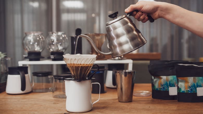 kettle pouring water on coffee