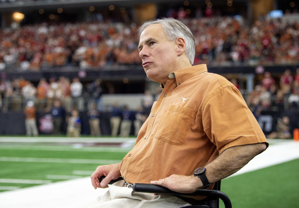 Texas Gov. Greg Abbott watches from the sidelines during the second half of the Big 12 Conference championship NCAA college football game between Oklahoma and Texas on Saturday, Dec. 1, 2018, in Arlington, Texas. (AP Photo/Jeffrey McWhorter)