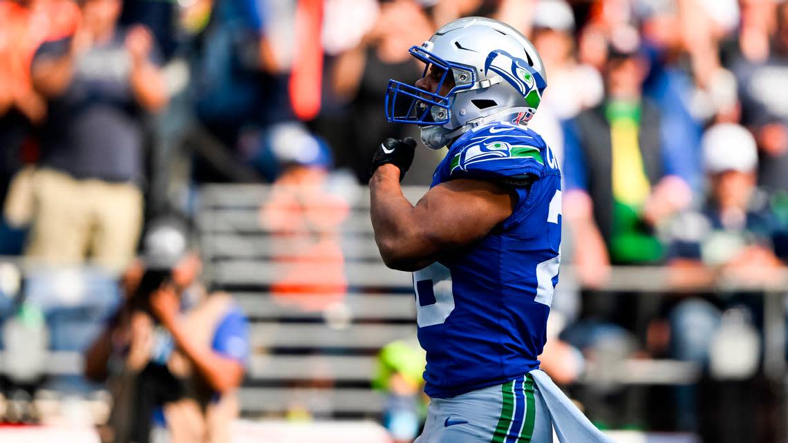 Seattle Seahawks running back Zach Charbonnet (26) celebrates a touchdown during the fourth quarter of the game against the Denver Broncos at Lumen Field, on Sunday, Sept. 8, 2024, in Seattle, Wash.