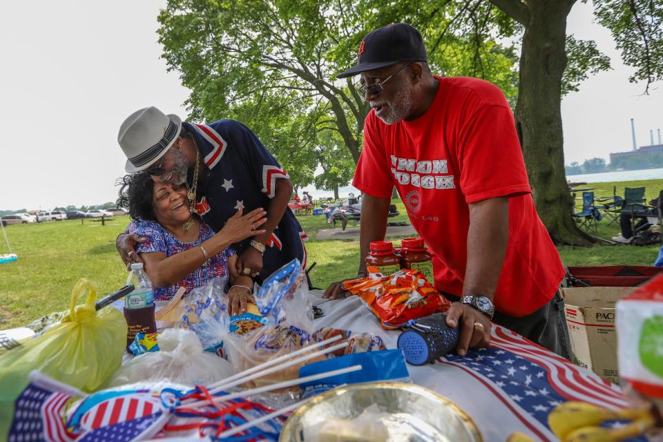 Carolyn Ramey, 66, of Royal Oak Township, gets a hug from a cousin during the Cushingberry family reunion, that has been going on since 1960, on Belle Isle in July 2019. "We just celebrate life and our family," Ramey said.