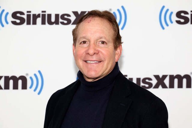 Steve Guttenberg smiles