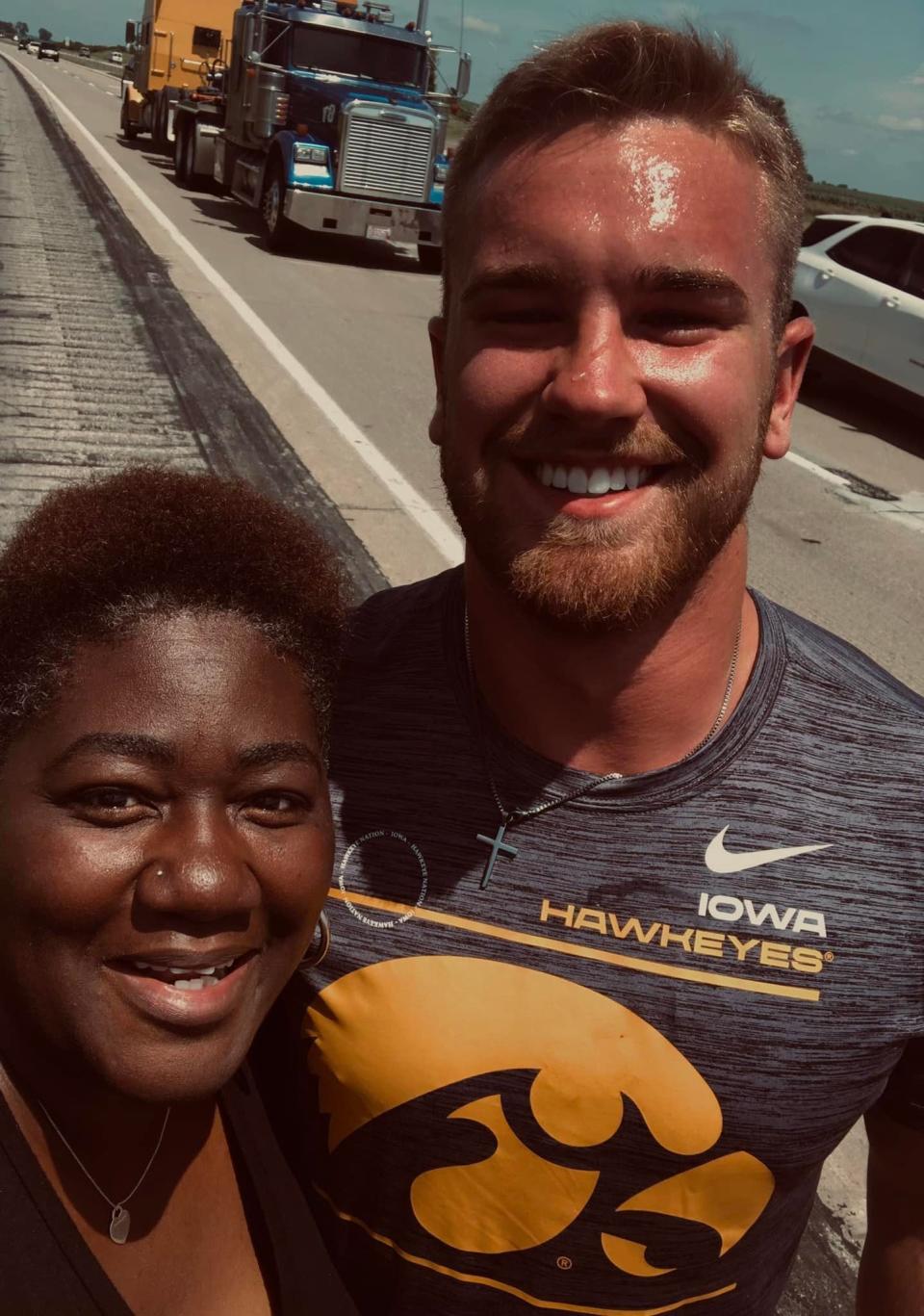 Iowa Hawkeyes linebacker Zach Twedt helped Nebraska resident Tina Gunn and her two sons change a flat tire on their car in 2022 after the family got stuck on the side Interstate 35 in Iowa.