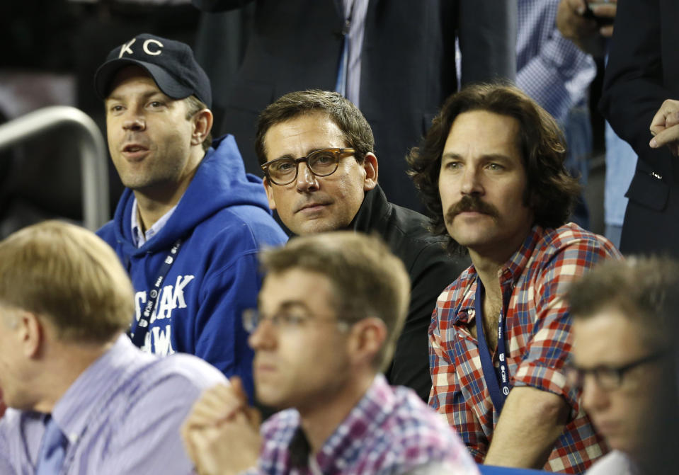 Actors and comedians Jason Sudeikis, Steve Carell and Paul Rudd sit in the stands for the NCAA Tournament final between Louisville and Michigan at the Georgia Dome in Atlanta, Georgia, Monday, April 8, 2013. (Photo by Mark Cornelison/Lexington Herald-Leader/MCT/Sipa USA)