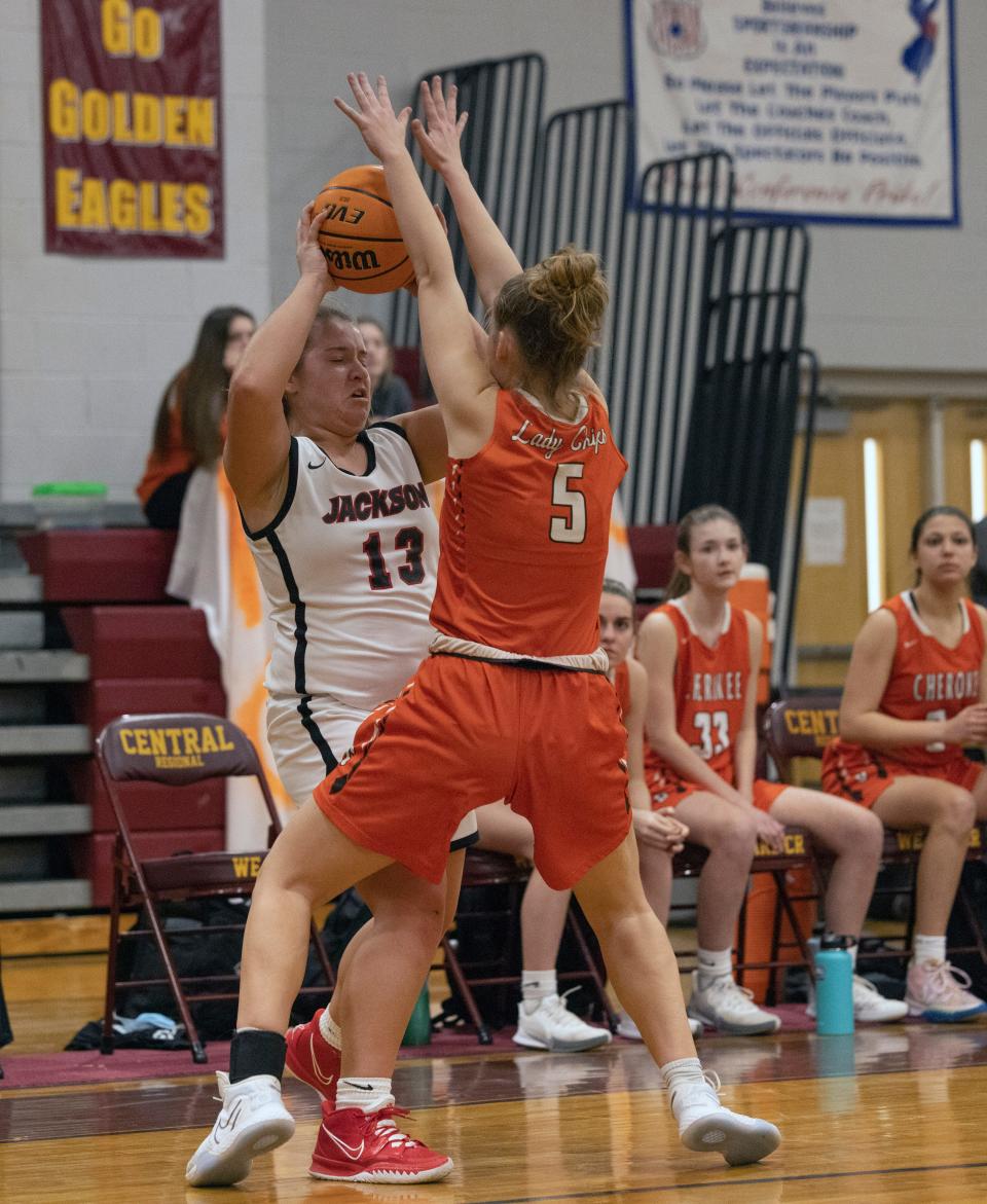 Jackson senior Brooke McKown tries to pass while being closely covered by Cherokee junior Delaney Jackson