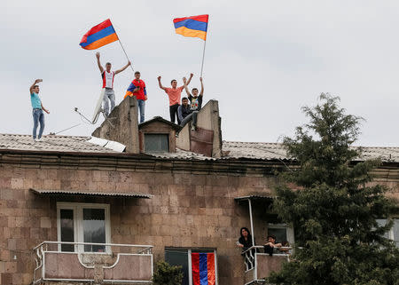 Supporters of Armenian opposition leader Nikol Pashinyan attend a rally in the town of Ijevan, Armenia April 28, 2018. REUTERS/Gleb Garanich