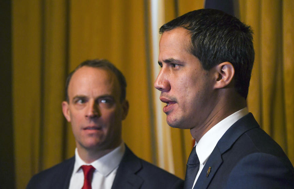 Venezuela's Opposition leader Juan Guaido, right, during a meeting with British Foreign Secretary Dominic Raab at Foreign Office in London, Tuesday, Jan. 21, 2020. (AP Photo/Alberto Pezzali)