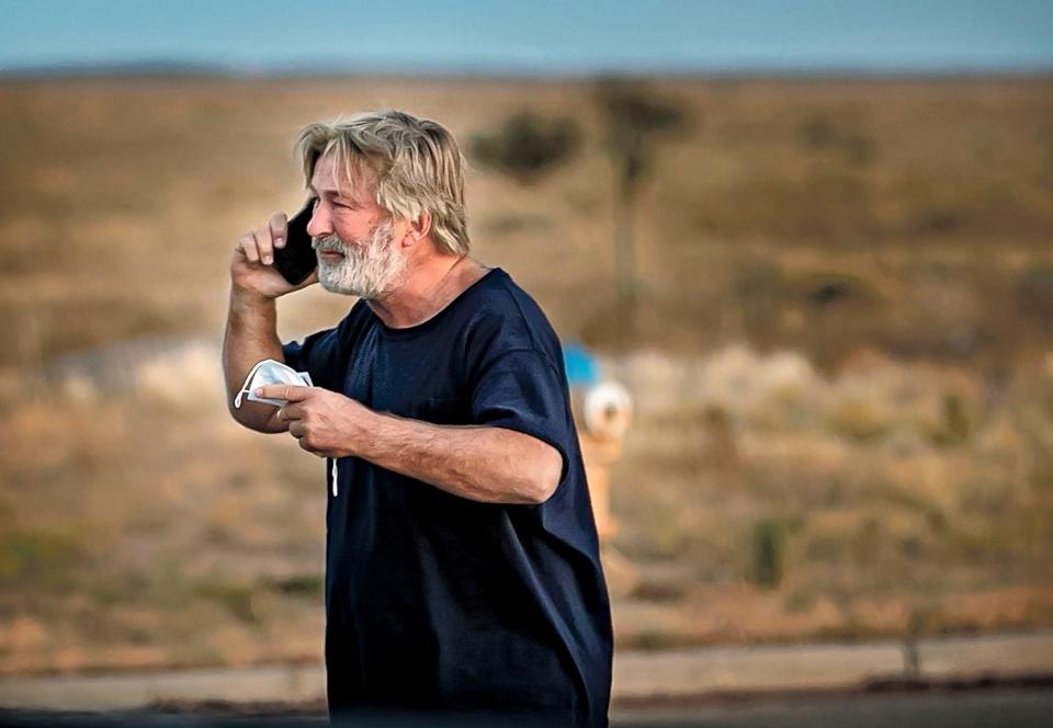 Alec Baldwin on the phone outside the Santa Fe County Sheriff's Office in Santa Fe, N.M., after he was questioned about a shooting on the set of the film "Rust" on the outskirts of Santa Fe, Thursday, Oct. 21, 2021.