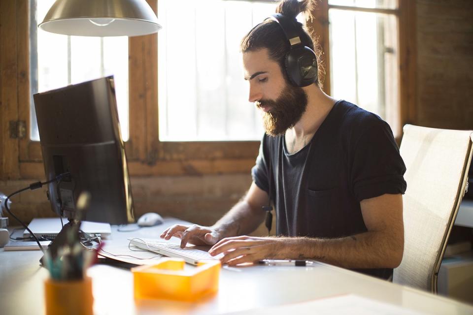 Young man working in a start up office.