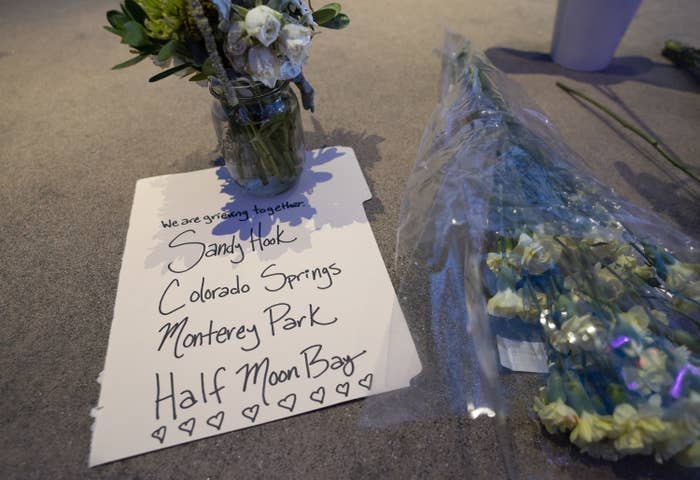 Flowers and a card are pictured at a makeshift memorial to honor the victims of the Half Moon Bay shootings on Jan. 24.