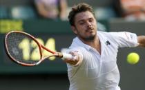 Stan Wawrinka of Switzerland plays a shot during his match against Victor Estrella Burgos of Dominican Republic at the Wimbledon Tennis Championships in London, July 1, 2015. REUTERS/Suzanne Plunkett