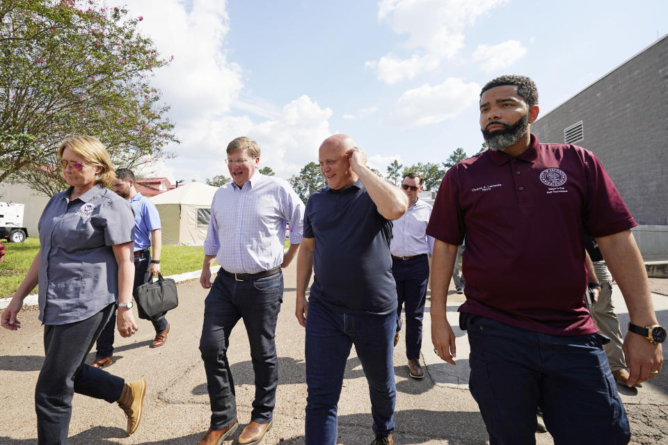 Deanne Criswell, administrator of the Federal Emergency Management Agency (FEMA), left, Mississippi Gov. Tate Reeves, second from left, White House Infrastructure Coordinator Mitch Landrieu, second from right, and Jackson Mayor Chokwe Antar Lumumba, tour the City of Jackson's O.B. Curtis Water Treatment Facility in Ridgeland, Miss., Friday, Sept. 2, 2022. Jackson's water system partially failed following flooding and heavy rainfall that exacerbated longstanding problems in one of two water-treatment plants. (AP Photo/Rogelio V. Solis)