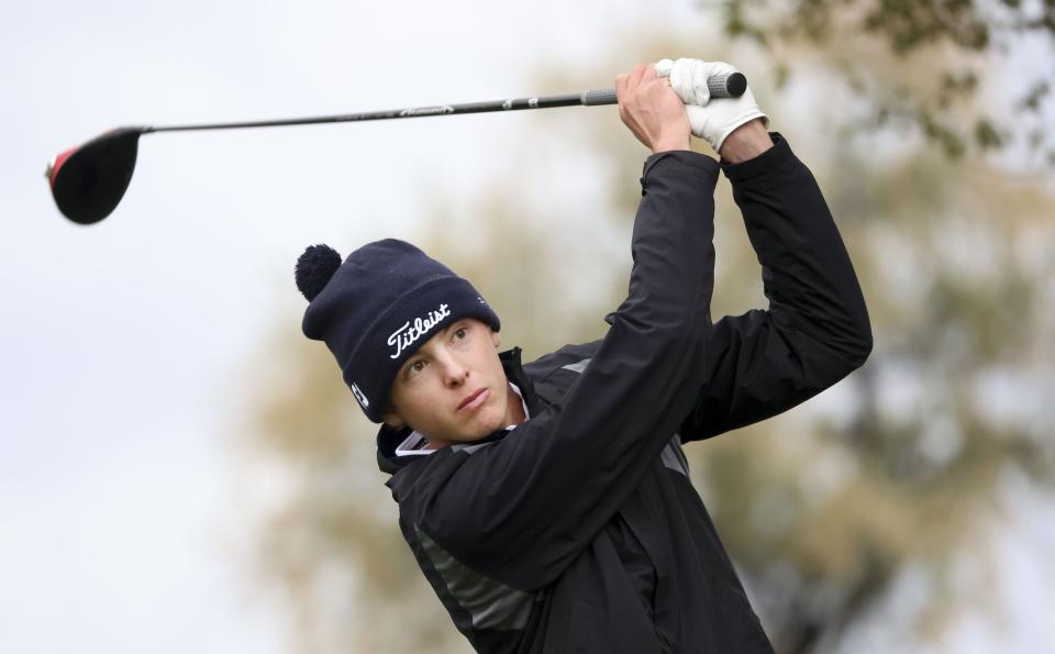 Morgan High School’s Lance Loughton Jr. swings his club