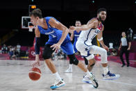 Czech Republic's Jan Vesely (24) drives past United States's Jayson Tatum (10) during a men's basketball preliminary round game at the 2020 Summer Olympics, Saturday, July 31, 2021, in Saitama, Japan. (AP Photo/Charlie Neibergall)