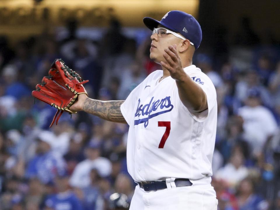 Dodgers pitcher Julio Urias reacts after an RBI single by Braves' Joc Pederson.