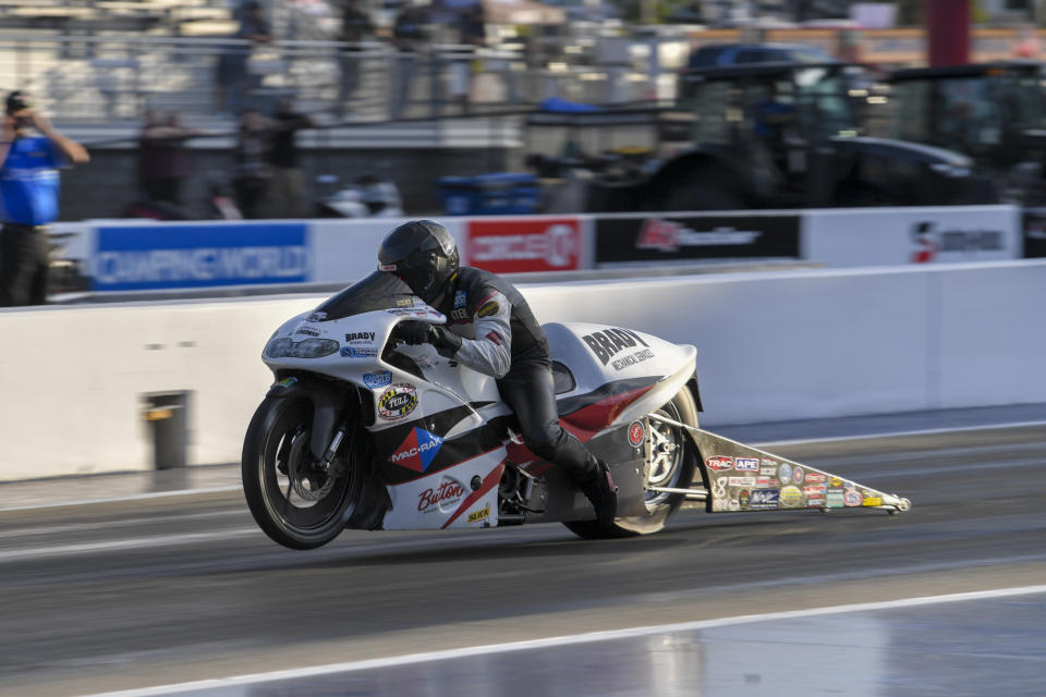 In this photo provided by the NHRA, Pro Stock Motorcycle points leader Steve Johnson races to the provisional No. 1 position in his first-round qualifying run on his Mac Rak/Slick 50 Suzuki at the DeWalt NHRA Carolina Nationals at zMAX Dragway in Concord, N.C., Friday, Sept. 17, 2021. (Richard H. Shute/NHRA via AP)