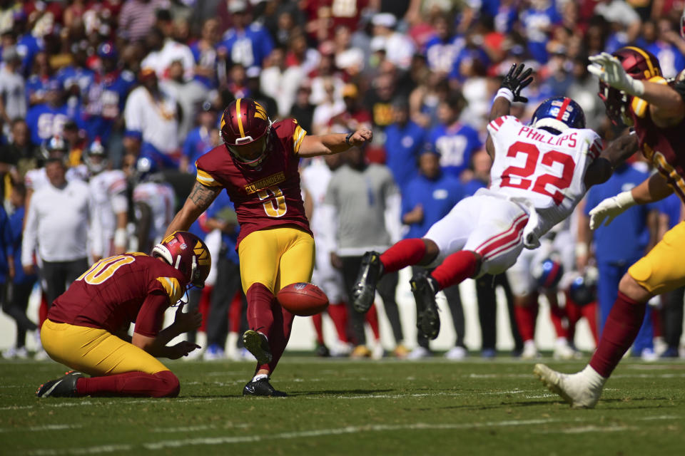 Washington Commanders place kicker Austin Seibert (3) kicks a field goal against the New York Giants' Dru Phillips (22) during the first half of an NFL football game in Landover, Md., Sunday, Sept. 15, 2024. (AP Photo/Steve Ruark)