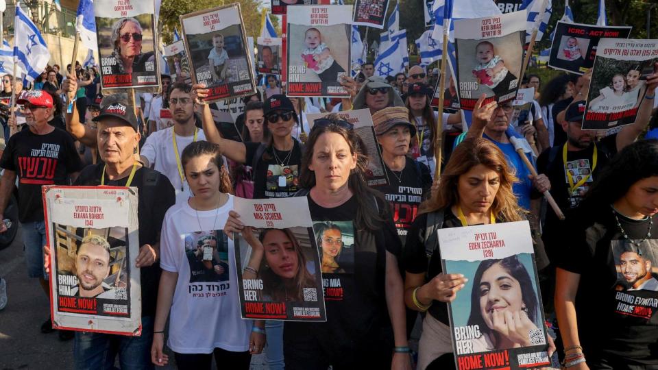 PHOTO: Relatives and friends of Israeli hostages held in Gaza since the October 7 attack by Hamas militants in southern Israel, hold placards and images of those taken during a protest for their release in the central city of Modiin, Nov. 16, 2023. (Menahem Kahana AFP via Getty Images)