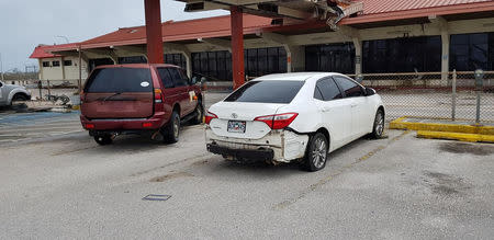 Damaged cars sit at Saipan International Airport after Super Typhoon Yutu hit the Northern Mariana Islands, U.S., October 25, 2018 in this image taken from social media. Brad Ruszala via REUTERS