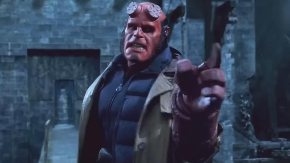 Ron Perlman points angrily in the middle of a castle setting in Hellboy.