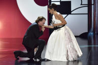 Singer Bono, left, kisses the hand of actress Penelope Cruz after she received the Donostia Award during an award ceremony at the 67th San Sebastian Film Festival, in San Sebastian, northern Spain Friday, Sept. 27, 2019. (AP Photo/Alvaro Barrientos)