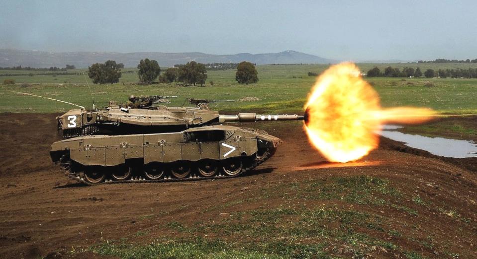 A late model Merkava Mk 3 subvariant seen firing its gun in training.<em> IDF</em>