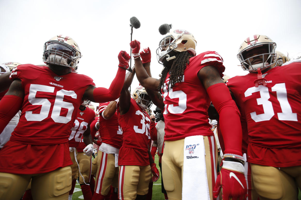 Kwon Alexander #56, Richard Sherman #25 and Raheem Mostert #31 of the San Francisco 49ers