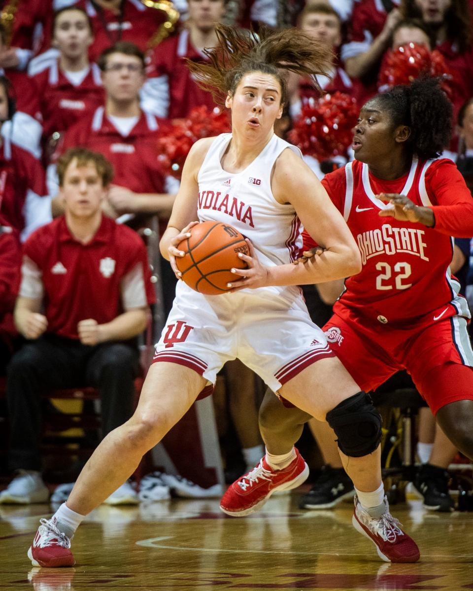 ndiana's Mackenzie Holmes (54) works in the post against Ohio State's Eboni Walker (22) during the first half of the Indiana versus Ohio State women's basektball game at Simon Skjodt Assembly Hall on Thursday, Jan. 26, 2023.