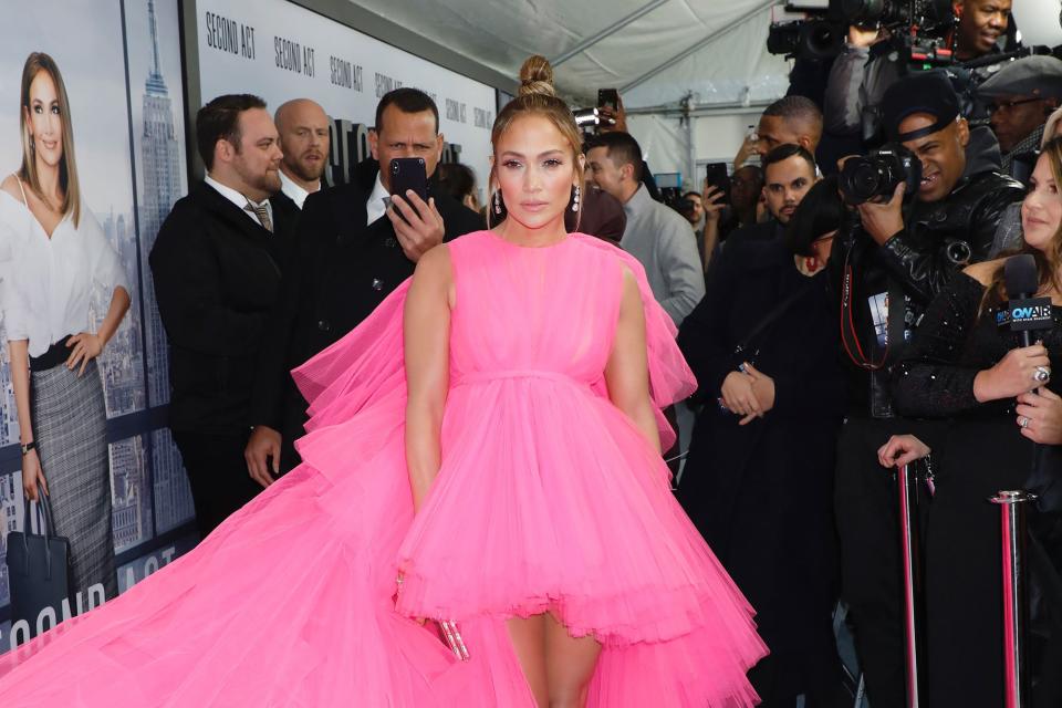 Rodriguez blended into the sea of paparazzi while working to hit his fiancée's best angles on the carpet. 