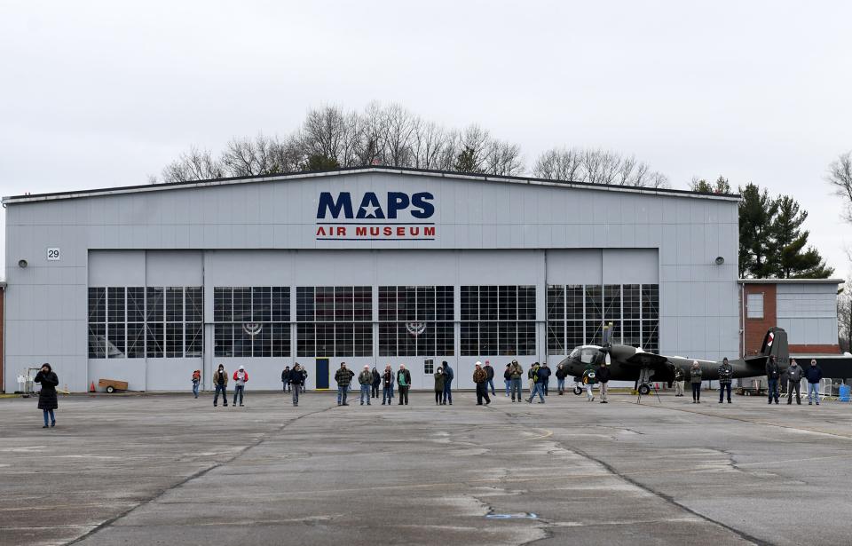 Spectators watch Saturday as a C-130H Hercules Air Force combat cargo aircraft, with the guidance from Mansfield Ohio Air National Guard 179th Airlift Wing, makes its way to the MAPS Air Museum in Green.