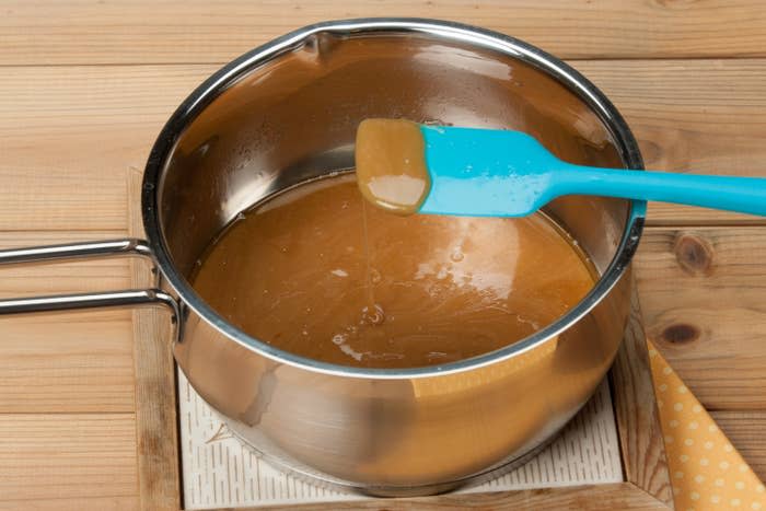 Cooking caramel in a pot.