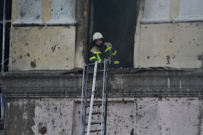 Rescuers extinguish a fire in a residential building after a rocket attack in Kiev. Aleksandr Gusev/SOPA Images via ZUMA Press Wire/dpa