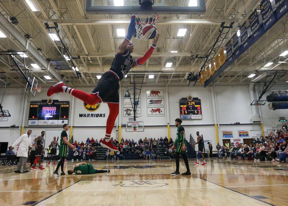 The Harlem Globetrotters' Buckets Barrera dunks the ball against the Washington Generals on Jan. 11, 2022, at Wausau West High School in Wausau, Wis. The Globetrotters are coming to Erie on Feb. 1.