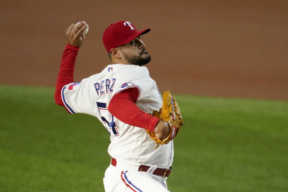 Texas Rangers starting pitcher Martin Perez throws to the Kansas City Royals in the first inning of a baseball game, Tuesday, May 10, 2022, in Arlington,Texas. (AP Photo/Tony Gutierrez)