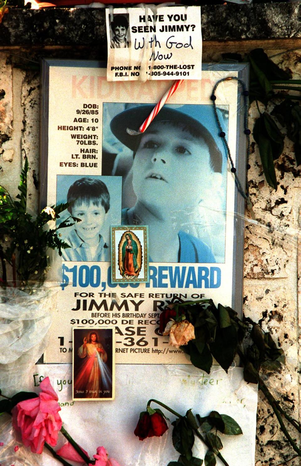 Poster and flowers outside the home of Jimmy Ryce.